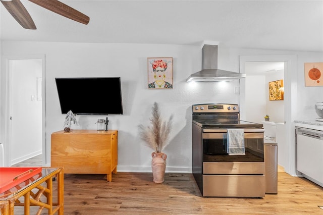 727 53rd Ter N, Saint Petersburg, FL 33703 - kitchen with light wood-type flooring, dishwashing machine, stainless steel range with electric stovetop, wall chimney exhaust hood, and a ceiling fan