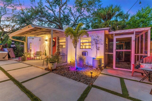 727 53rd Ter N, Saint Petersburg, FL 33703 - view of front of home featuring stucco siding and a patio