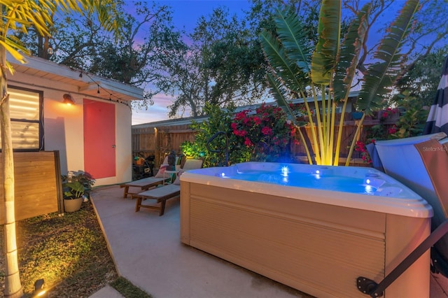 727 53rd Ter N, Saint Petersburg, FL 33703 - view of patio with a hot tub and fence
