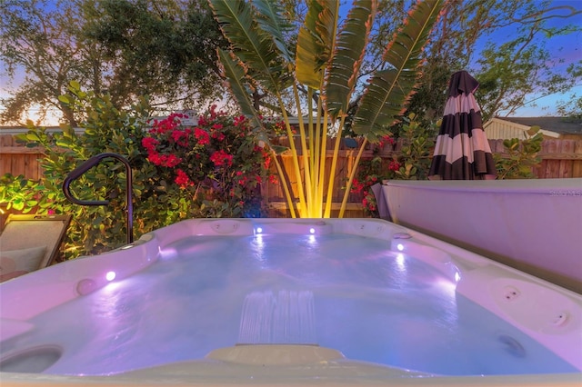 727 53rd Ter N, Saint Petersburg, FL 33703 - view of swimming pool with a hot tub and fence