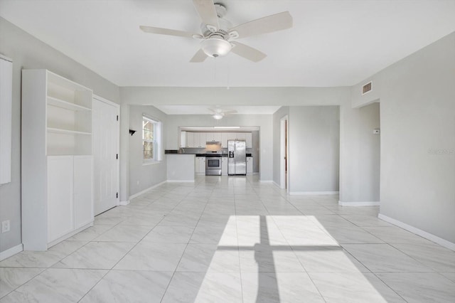 unfurnished living room with ceiling fan