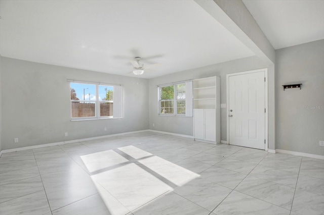 empty room featuring ceiling fan