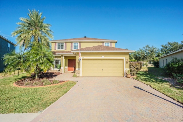 view of front facade featuring a front yard and a garage