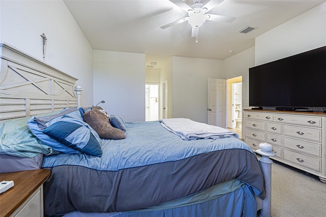 bedroom with carpet, ceiling fan, and ensuite bath