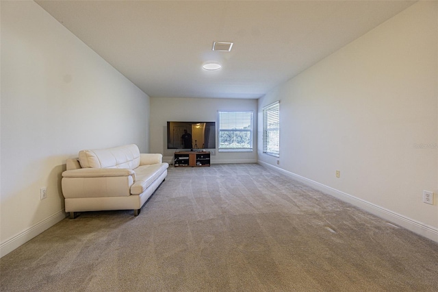 unfurnished room with light carpet