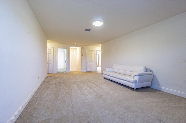 unfurnished room featuring light colored carpet