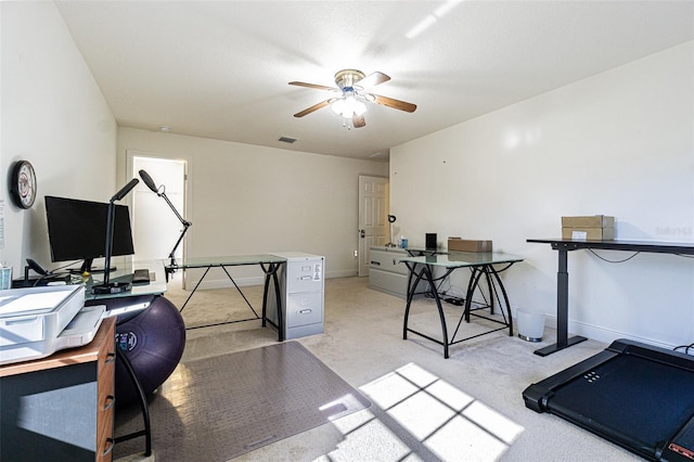 office with light colored carpet and ceiling fan