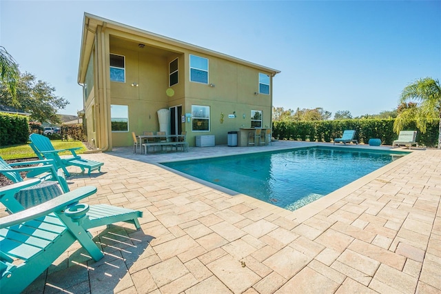 view of swimming pool with a patio