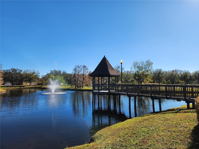 dock area with a gazebo and a water view