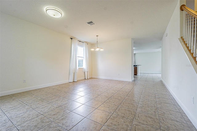 5709 White Trillium Loop, Land O Lakes, FL 34639 - empty room with light tile patterned floors, stairway, and baseboards