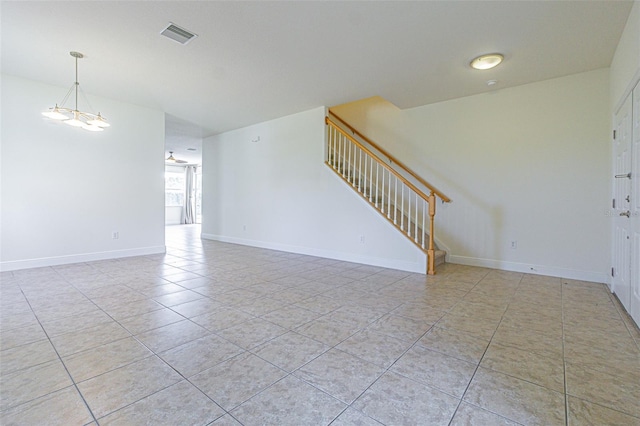 5709 White Trillium Loop, Land O Lakes, FL 34639 - unfurnished living room with stairway, light tile patterned floors, and baseboards