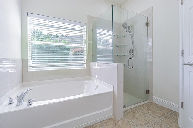 5709 White Trillium Loop, Land O Lakes, FL 34639 - full bath with a garden tub, a stall shower, and tile patterned flooring