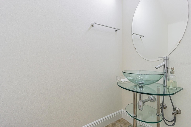 5709 White Trillium Loop, Land O Lakes, FL 34639 - bathroom featuring baseboards, a sink, and tile patterned floors