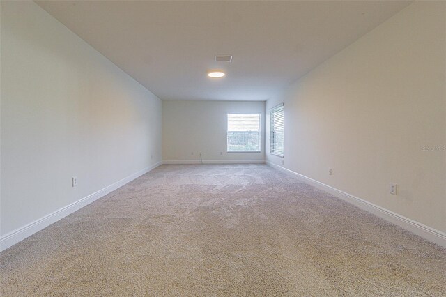 5709 White Trillium Loop, Land O Lakes, FL 34639 - empty room with light carpet and baseboards