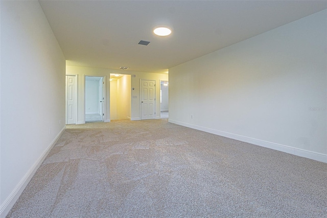 5709 White Trillium Loop, Land O Lakes, FL 34639 - empty room featuring light carpet and baseboards