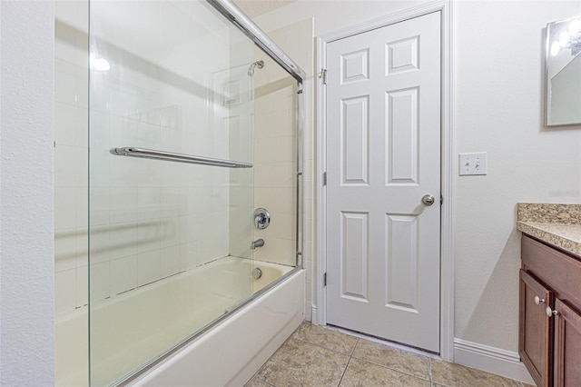 5709 White Trillium Loop, Land O Lakes, FL 34639 - full bathroom featuring vanity, tile patterned floors, and shower / bath combination with glass door