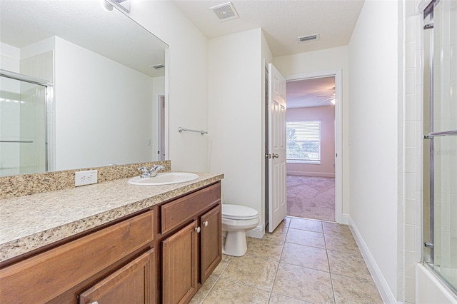 5709 White Trillium Loop, Land O Lakes, FL 34639 - full bath with a shower with shower door, toilet, tile patterned flooring, vanity, and baseboards