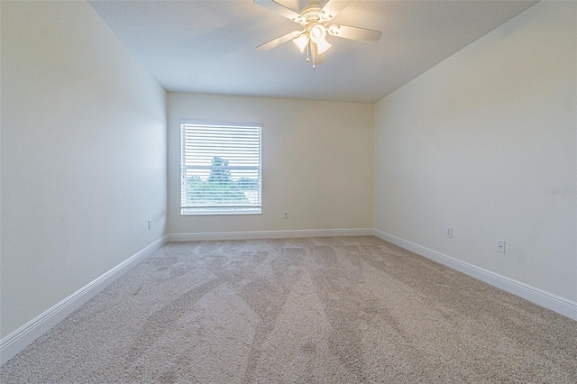 5709 White Trillium Loop, Land O Lakes, FL 34639 - empty room featuring light colored carpet, ceiling fan, and baseboards