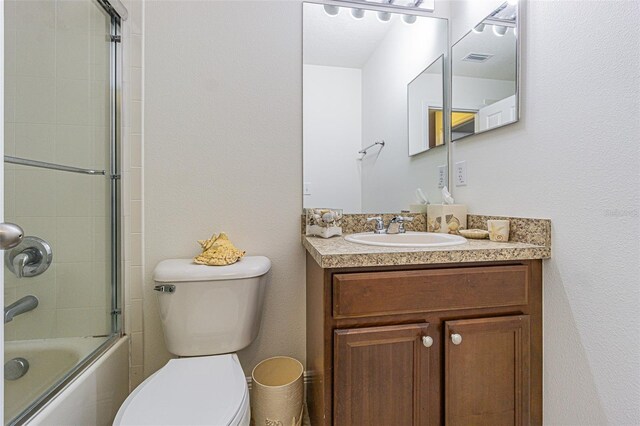 5709 White Trillium Loop, Land O Lakes, FL 34639 - full bathroom with toilet, vanity, and enclosed tub / shower combo
