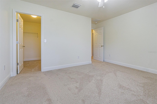 5709 White Trillium Loop, Land O Lakes, FL 34639 - carpeted spare room featuring baseboards and a ceiling fan