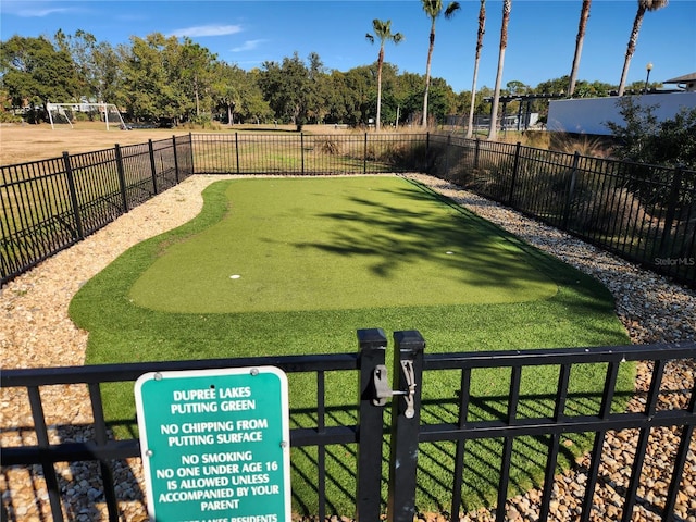 5709 White Trillium Loop, Land O Lakes, FL 34639 - view of community featuring fence and an area to practice putting