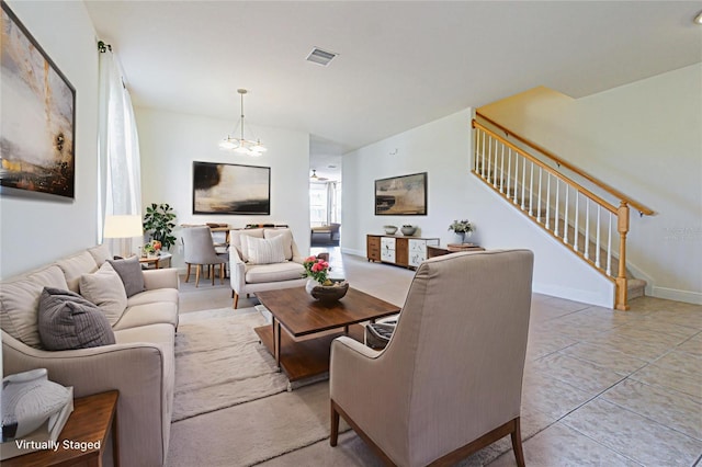 5709 White Trillium Loop, Land O Lakes, FL 34639 - living area featuring stairs, a chandelier, and lofted ceiling
