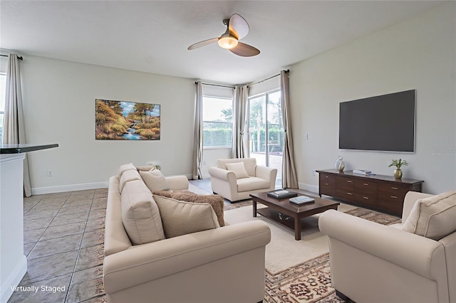 5709 White Trillium Loop, Land O Lakes, FL 34639 - living area with a ceiling fan and baseboards