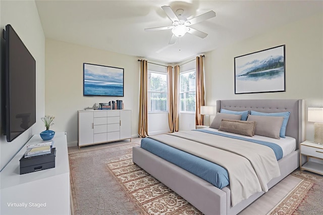 5709 White Trillium Loop, Land O Lakes, FL 34639 - bedroom with light colored carpet and ceiling fan