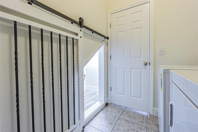 5709 White Trillium Loop, Land O Lakes, FL 34639 - bathroom featuring tile patterned floors and independent washer and dryer
