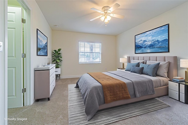 5709 White Trillium Loop, Land O Lakes, FL 34639 - bedroom with light carpet and a ceiling fan