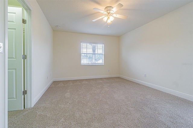 5709 White Trillium Loop, Land O Lakes, FL 34639 - spare room featuring light carpet and ceiling fan