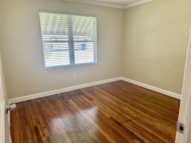 1003 Beverly Ave, Largo, FL 33770 - spare room with ornamental molding, dark wood finished floors, and baseboards