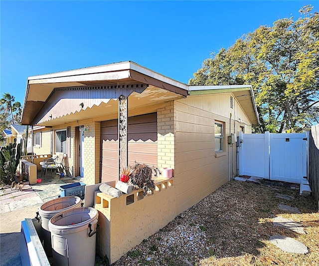 view of property exterior featuring a patio