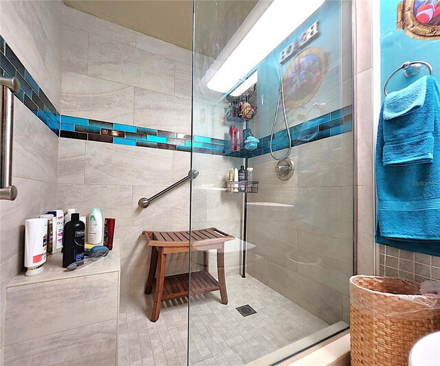 7521 Coventry Dr, Port Richey, FL 34668 - bathroom featuring tile walls and a walk in shower