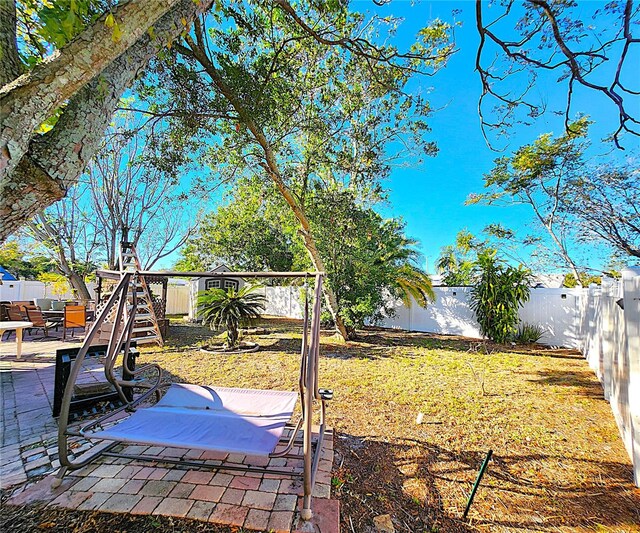 7521 Coventry Dr, Port Richey, FL 34668 - fenced backyard with a patio