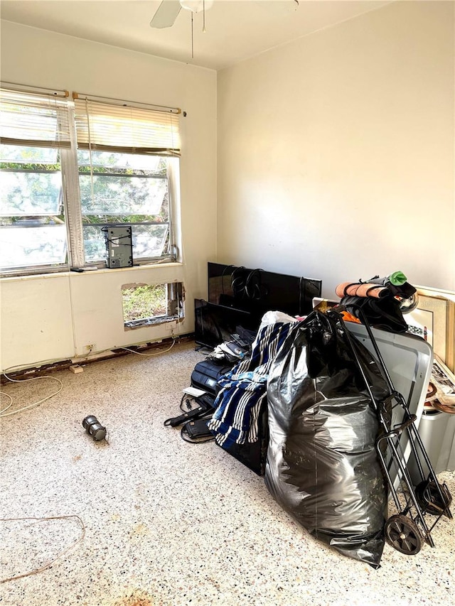 interior space featuring ceiling fan and a healthy amount of sunlight