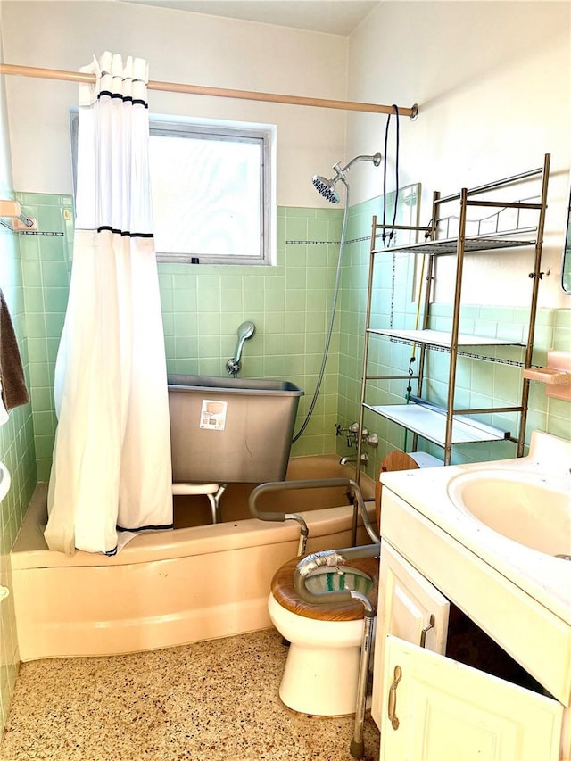 full bathroom featuring vanity, shower / bath combo, and toilet