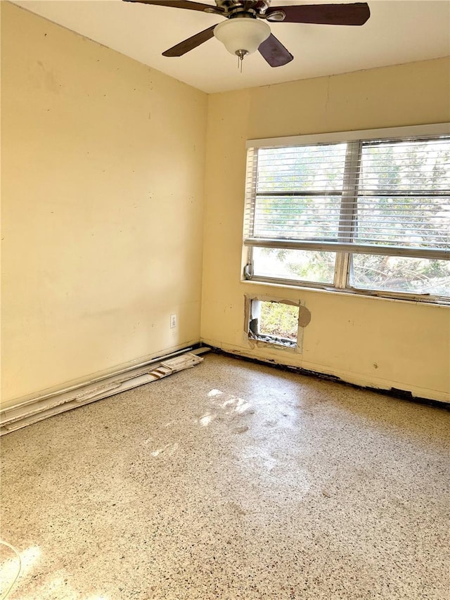 empty room featuring ceiling fan