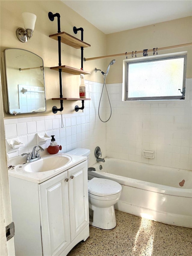 full bathroom featuring tasteful backsplash, vanity, tile walls, toilet, and tiled shower / bath