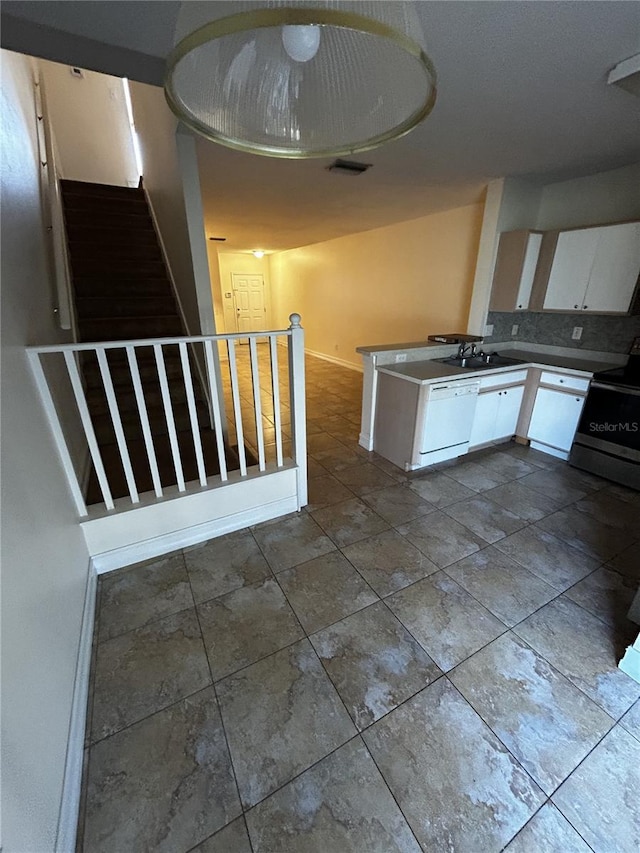 kitchen with stainless steel electric range oven, sink, white cabinets, and white dishwasher