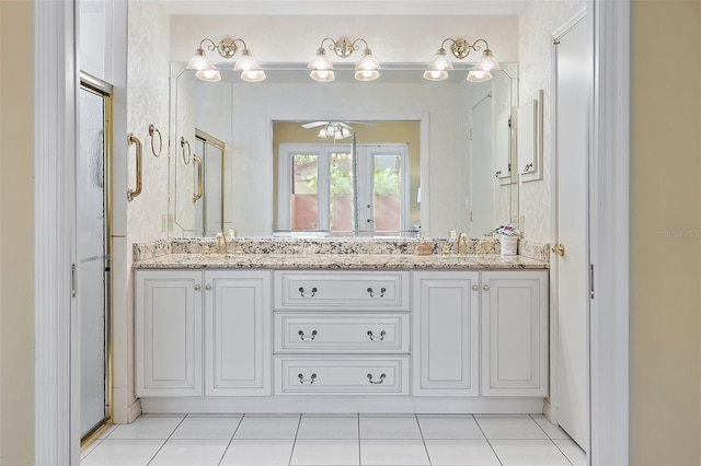 bathroom with tile patterned flooring, ceiling fan, and vanity