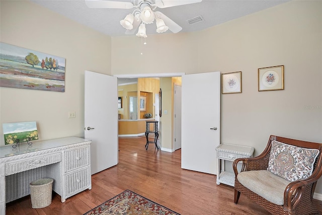 office space with ceiling fan and wood-type flooring