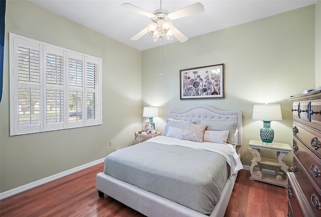 bedroom featuring dark hardwood / wood-style floors and ceiling fan