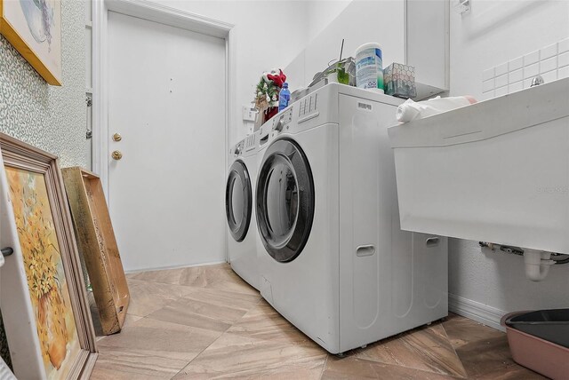 washroom with washer and dryer