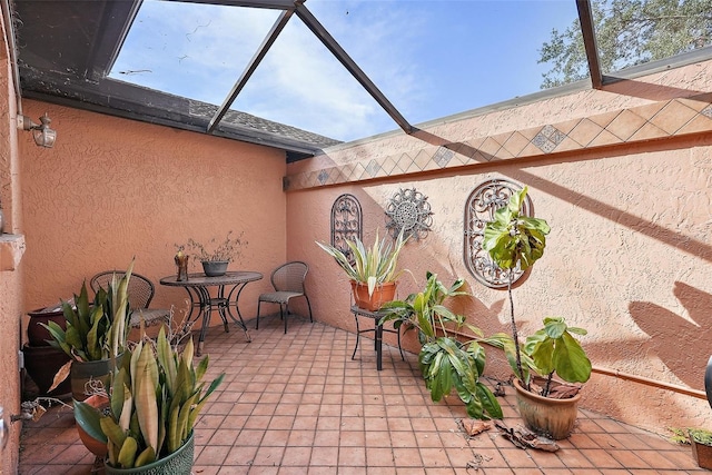 view of patio / terrace with glass enclosure