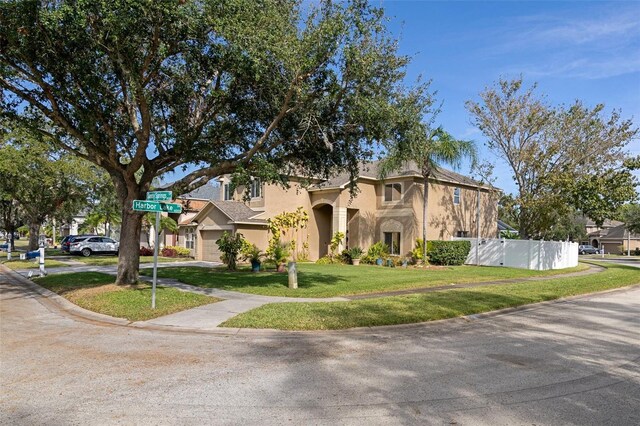 view of front of house featuring a front yard and a garage