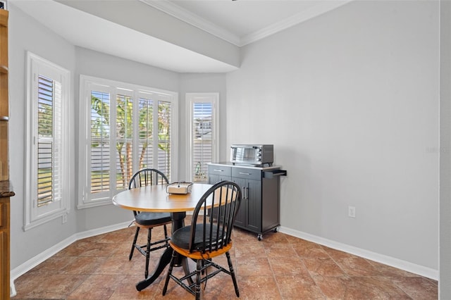 dining area with ornamental molding