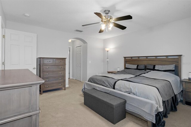 carpeted bedroom with ceiling fan