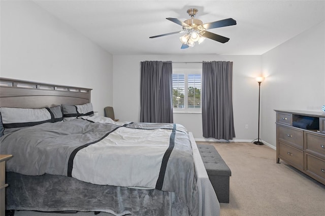 bedroom featuring ceiling fan and light colored carpet