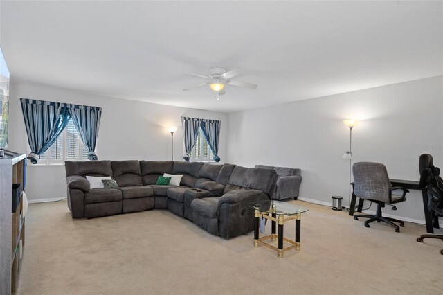 living room with light carpet and ceiling fan